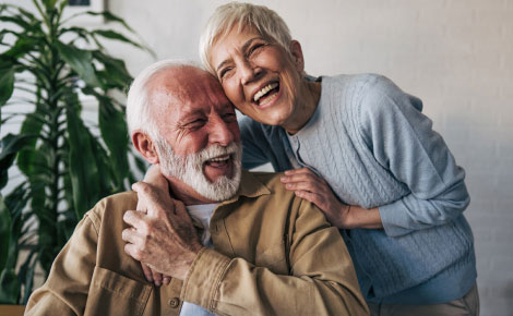 mature couple embracing and laughing