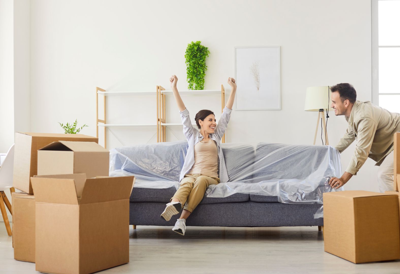 happy couple moving into a new home